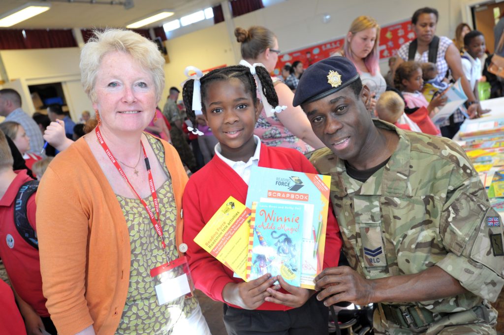 A picture of an Armed Forces family accessing books from Reading Force