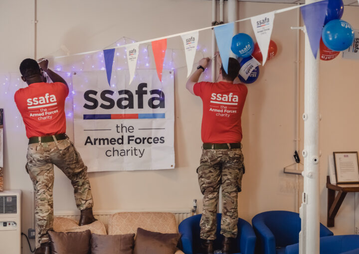 SSAFA supporters hang signs and bunting
