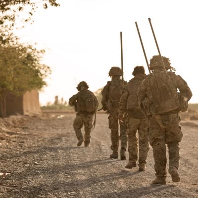 Troops walking with rifles