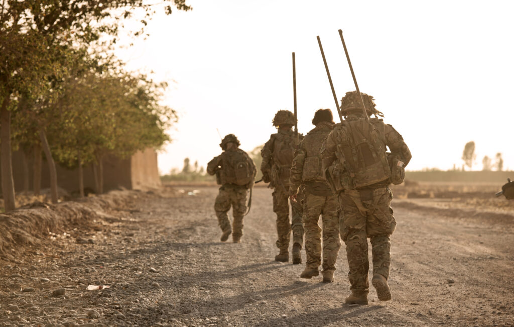 Soldiers walking with rifles