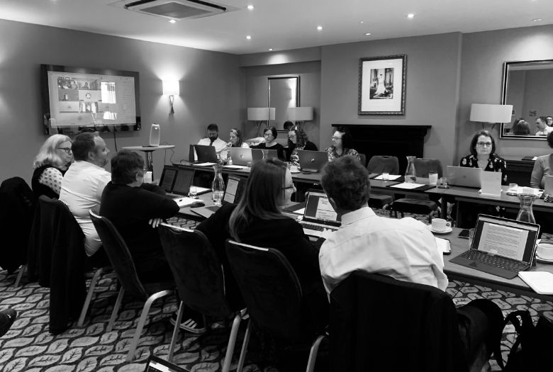 Trustees attending a board meeting